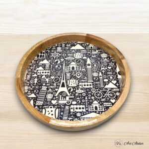 Rustic round wooden tray on farmhouse-style table