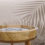 Small round wood table with mid-century design