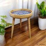 Contemporary side table beside fabric sofa
