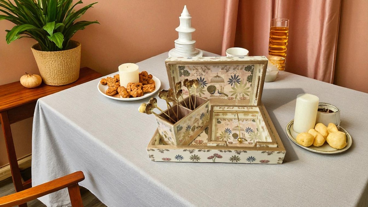 An elegant, dark wood **rectangular tray** holding a coffee mug, a small vase with flowers, and a book on a bed, suggesting a cozy morning.