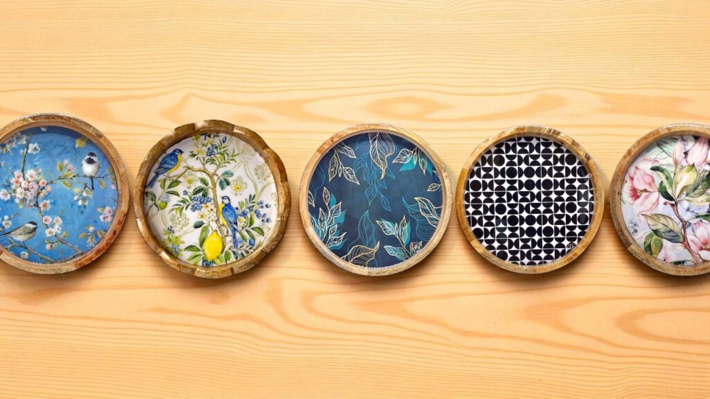 Minimalist round wooden serving tray holding tea cups and snacks