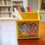 A collection of various handmade pen stands on a wooden table, showcasing a range of styles and materials.
